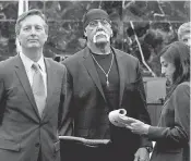  ?? DIRK SHADD, AP ?? Hulk Hogan, center, was awarded $ 140 million in damages. Wednesday, a judge denied Gawker’s motion for a new trial.