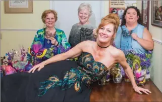  ?? WILLIAM HARVEY/RIVER VALLEY & OZARK EDITION ?? Shoshana Wells, front, is the executive director of Margie’s Haven House in Heber Springs. Standing behind her are, from left, Cindy Greaves, treasurer; Leigh Neuwirth, president; and Velder Shepperson, lead victim advocate. The women were preparing...