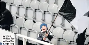  ??  ?? A youn United fan with a Wor Flags flag