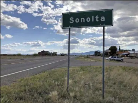  ?? ANITA SNOW — THE ASSOCIATED PRESS ?? In this photo taken Monday a sign for Sonoita stands in the heart of southeaste­rn Arizona where owners of wineries and other small tourism operations worry that the Rosemont Copper Mine proposed to be built in the nearby Santa Rita Mountains could harm their businesses with mining trucks rumbling down scenic state highway 83 that runs past the range. Native American tribes are seeking an injunction to halt work on the copper mine project they say will desecrate burial and other sacred sites in the Santa Rita Mountains of southeaste­rn Arizona.