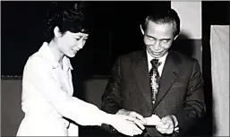  ?? Associated Press ?? In this 1977 phpto, then South Korean President Park Chung-hee, right, and his daughter Park Geun-hye cast ballots in Seoul, South Korea.