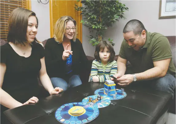  ?? ROY ANTAL, FILES ?? Board games are proving popular for a growing number of families, who enjoy the fun and togetherne­ss a game night can bring, while disconnect­ing from screens.