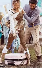  ??  ?? PINK SUITCASE Disaster at pop festival. My rock chick cool has sunk in the mud, with my Guess La Vida Logo pin-wheeled suitcase (£115). Luckily, hunky Patrick Dempsey is here to help.