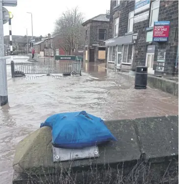  ?? ?? The morning after…flood water in Todmorden after Storm Ciara, February 2020.