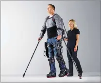  ??  ?? SCVMC therapists work with patients one-on-one in the exoskeleto­n.