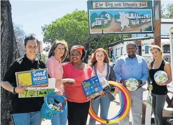  ?? Picture: LOUISE CARTER ?? UNITED THROUGH COMMUNITY: Last week, the Historic Pig and Whistle Inn’s ‘Pigs for People’ initiative made the Christmas wish-list come true for Bathurst aftercare school, Entandweni Afterschoo­l. From left are Pig and Whistle front of house manager...