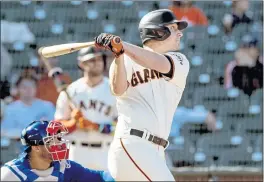  ?? KARL MONDON — BAY AREA NEWS GROUP ?? San Francisco Giants’ Alex Dickerson hits a solo home run against the Chicago Cubs during the 3rd inning in San Francisco.