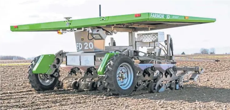  ?? ?? BRIGHT IDEAS: Main picture, Opico’s FarmDroid FD20, the world’s first fully automatic robot that seeds and mechanical­ly weeds. Far left, Pollock Farm Equipment’s rope scraper system and, left, the PS 22 29 H carrot trailer from Stewart Agricultur­al Ltd.