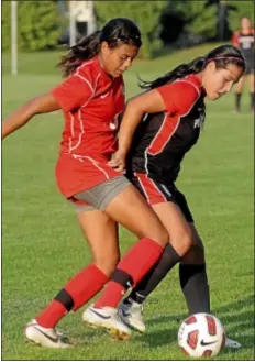  ?? Trentonian PHOTO/JACKIE SCHEAR ?? Pennington’s Erica Murphy, right, tries to keep the ball away from Lawrencevi­lle’s Alana Cook.