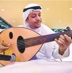  ?? Ahmed Ramzan/ Gulf News ?? An musician at the Abu Dhabi stand.