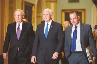  ?? AP-Yonhap ?? Senate Majority Leader Mitch McConnell, left, Vice President-elect Mike Pence, center, and Trump Chief of Staff Reince Priebus walk into a meeting together on Capitol Hill in Washington, Wednesday.