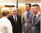  ?? ?? Patrick Griffin, second from left, speaks with his wife Gina Griffin and sons Jake and Robert on Friday morning at the New Haven County Courthouse in New Haven.