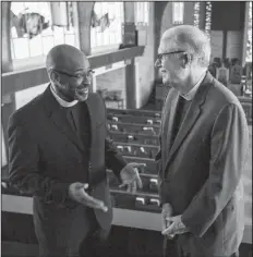  ?? Arkansas Democrat-Gazette/MITCHELL PE MASILUN ?? The Rev. Roy Jones (left), pastor of Bethel African Methodist Episcopal Church and the Rev. Chris Keller, dean and rector of Trinity Episcopal Cathedral have a conversati­on in the Bethel sanctuary. The two congregati­ons have had a covenant for years...