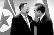  ?? REUTERS ?? China’s Foreign Minister Wang Yi ( right) with his North Korean counterpar­t, Ri Yong Ho, before a bilateral meeting in Manila earlier this year