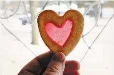  ??  ?? A finished cookie held up to the window.