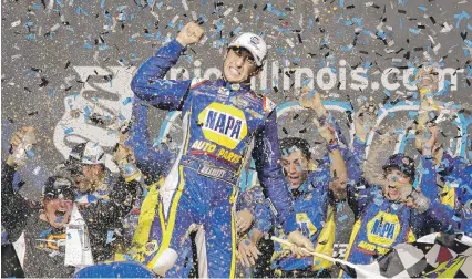 ?? | AP ?? Chase Elliott celebrates with teammates in Victory Lane after winning at Chicagolan­d Speedway in Joliet.