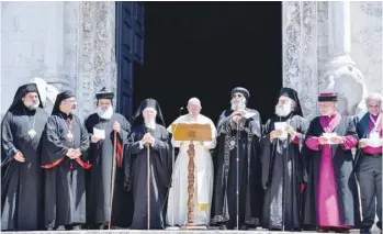  ?? — AFP ?? Pope Francis (C) delivers his speech as other religious leaders look on after their meeting at the Pontifical Basilica of St Nicholas in Bari, Italy, on Saturday.