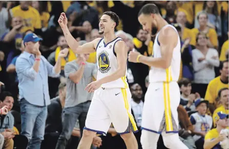  ?? EZRA SHAW GETTY IMAGES ?? Golden State’s Klay Thompson, left, led the Warriors with 35 points in a 115-86 win over Houston on Saturday night to force Monday’s Game 7.