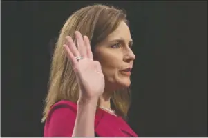  ?? The Associated Press ?? BARRETT: Supreme Court nominee Amy Coney Barrett is sworn in for her confirmati­on hearing before the Senate Judiciary Committee, Monday, on Capitol Hill in Washington.