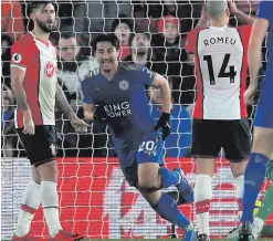  ??  ?? All smiles: Shinji Okazaki wheels away with delight after scoring the first of his double against Southampto­n