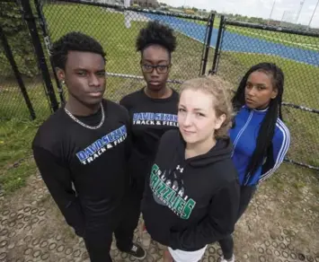  ?? BERNARD WEIL/TORONTO STAR ?? Darnell Bartholome­w, left, Natasha McDonald, Maddy Crawford and Antoinette Sebastian are among the athletes at David Suzuki Secondary School who were denied access to their school track due to the ongoing strike.