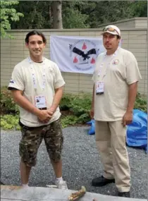  ?? STEVE MILTON, THE HAMILTON SPECTATOR ?? Allen King, left, and Geoffrey Daybutch are the fire keepers for North American lndigenous Games western hub at McMaster University.