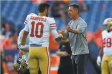  ?? Justin Edmonds / Getty Images ?? Kyle Shanahan (right) must decide if Jimmy Garoppolo is the future.