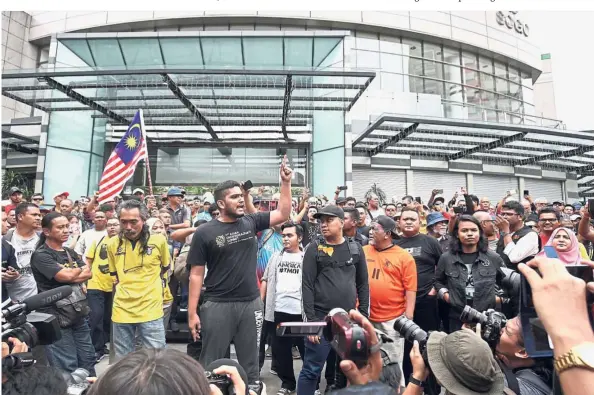  ??  ?? Making his point: A protester speaking to the media during the Nab A Thief rally in front of the Sogo Shopping Complex in Kuala Lumpur.