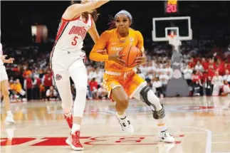  ?? AP FILE PHOTO/JOE MAIORANA ?? Tennessee guard Jordan Walker, right, had a team-high eight assists, plus six rebounds and as many points to help the Lady Vols to an SEC win against Vanderbilt on Sunday in Knoxville.
