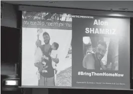  ?? OLIVIER MATTHYS UPI ?? A screen shows pictures of Alon Shamriz, one of three Israeli hostages mistakenly killed by Israeli Defense Forces on Friday, as supporters and relatives attended a meeting of the European Parliament in Brussels on Dec. 5.