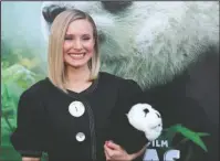  ?? The Associated Press ?? ADORABLE AND EDUCATIONA­L: Kristen Bell holds a stuffed panda teddy bear at the LA Premiere of “Pandas” in Los Angeles on March 17. Bell narrates the documentar­y which will be in wide release beginning Friday.