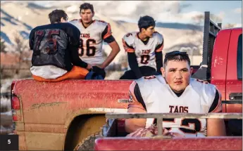  ?? NATHAN BURTON/Taos News ?? 5. Taos Tigers’ Leonard Archuleta sits in the back of a teammate’s pickup after a cold and muddy practice Tuesday (Nov. 15). 5