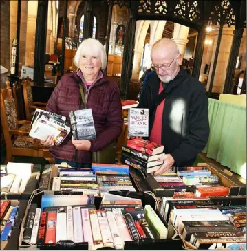  ?? ?? BOOKENDS: Enjoying the feast of writing at Silkstone Parish Church’s ‘mega’ book sale are Jenny and Percy Beech. Picture: Wes Hobson. PD091483