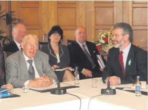  ??  ?? Ian Paisley and Gerry Adams after agreeing to share power at Stormont in 2007