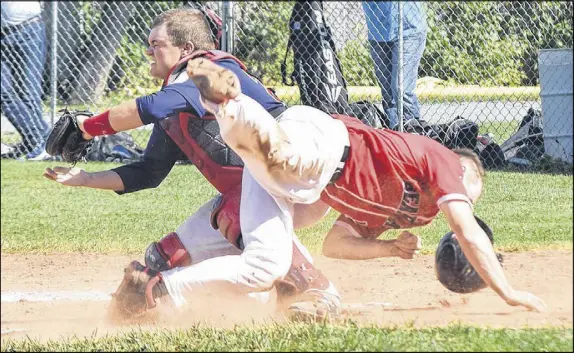  ?? TRURO DAILY NEWS PHOTO ?? John Chapman of the Truro Bearcats barrels into Sydney’s Jordan Sampson as the catcher attempts to block the plate during Saturday’s NSSBL playoff action in Truro. Chapman scored here but it wasn’t nearly enough as the Sooners went on to a 13-2 win,...