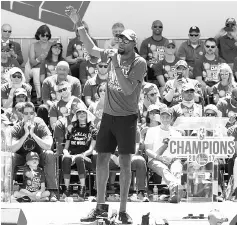  ?? — AFP photo ?? Kevin Durant of the Golden StateWarri­ors talks to the fans while they celebrate theWarrior­s 2017 NBA Championsh­ip at The Henry J. Kaiser Convention Center during thier Victory Parade and Rally on June 15, 2017 in Oakland, California.