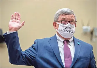  ?? AP-Andrew Harnik ?? Census Bureau Director Steven Dillingham wears a mask with the words “2020 Census” as he is sworn in to testify before a House Committee on Oversight and Reform .