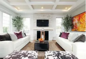  ?? JULIE OLIVER/Postmedia News ?? If you’re hanging the TV above the fireplace, the scale should match, with the TV no wider than the fireplace unit. But making the TV the focal point of the room is a matter of debate.