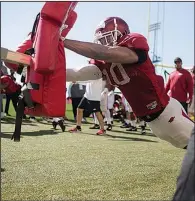  ?? NWA Democrat-Gazette/CHARLIE KAIJO ?? Arkansas Razorbacks linebacker Randy Ramsey performs drills during practice March 3 at the University of Arkansas, Fayettevil­le.