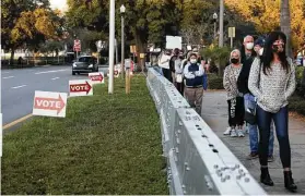  ?? New York Times file photo ?? Voters stand outside a polling location in 2020 in St. Petersburg, Fla. Democratic officials say they are resigned to organizing their way around the new voting restrictio­ns passed in GOP-controlled states.