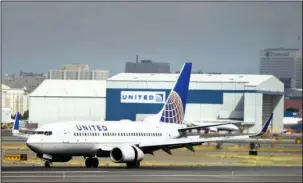  ?? The Associated Press ?? LEGGINGS DEBATE: In this Sept. 8, 2015, file photo, a United Airlines passenger plane lands at Newark Liberty Internatio­nal Airport in Newark, N.J. United said on Monday that regular-paying fliers are welcome to wear leggings aboard its flights, even...