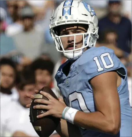  ?? CHRIS SEWARD, FILE — THE ASSOCIATED PRESS ?? North Carolina quarterbac­k Drake Maye (10) looks to pass against Syracuse during the first half of an NCAA college football game Saturday, Oct. 7, 2023, in Chapel Hill, N.C.