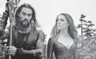  ?? AP ?? Jason Momoa, left, and Amber Heard star in “Aquaman,” which ruled the box office for the second consecutiv­e week.