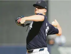  ?? FRANK FRANKLIN II/AP ?? The Yankees’ Clarke Schmidt warms up during the seventh inning of a spring training game against the Rays on Feb. 27 in Tampa, Fla.