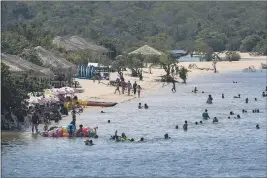  ?? ANDRE PENNER — THE ASSOCIATED PRESS ?? People swim in Alter do Chao, district of Santarem, Para state, Brazil.