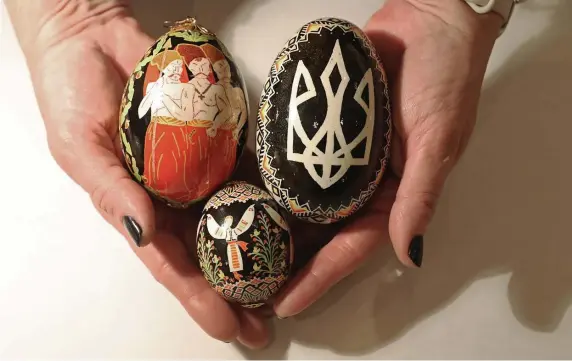  ?? TNS ?? CARRYING ON: Artist Anna Chychula displays a collection of her Ukrainian pysanky eggs during a workshop last month at the Ukrainian National Museum in Chicago.