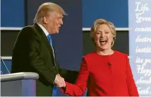  ?? PHOTO: REUTERS ?? Republican presidenti­al nominee Donald Trump greets Democratic nominee Hillary Clinton after their first presidenti­al debate at Hofstra University in Hempstead, New York.