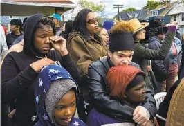  ?? MUSTAFA HUSSAIN NYT ?? A crowd gathers outside the Delavan Grider Community Center as President Joe Biden speaks there Tuesday, days after the massacre at a store in Buffalo, N.Y.