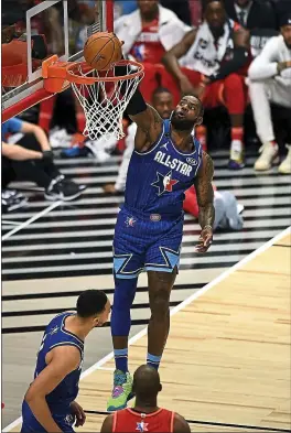  ?? STACY REVERE — GETTY IMAGES ?? LeBron James of Team LeBron dunks against Team Giannis in the NBA All-Star Game Sunday night in Chicago. James had 23point in a winning effort.