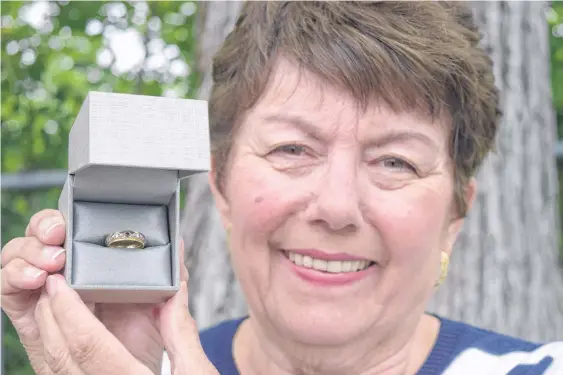  ?? SHARON MONTGOMERY-DUPE • CAPE BRETON POST ?? Sharon King of Ben Eoin holds a ruby and diamond ring her friend, the late Linda Mercer, found 20 years ago in Sydney River. King hopes to find the owner and possibly, the love story behind the ring.